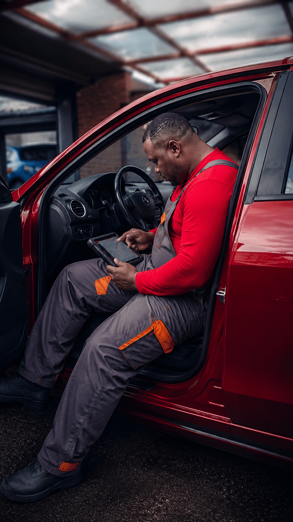 SOB Autofix technician carrying out a vehicle check at the customer's location