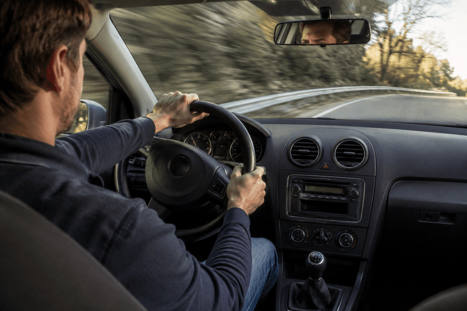 Driver travelling in a vehicle on an open road