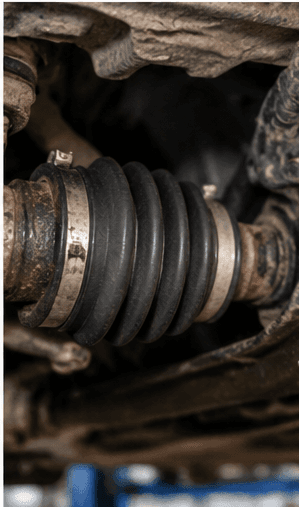 Close view of a vehicle CV joint and drive shaft